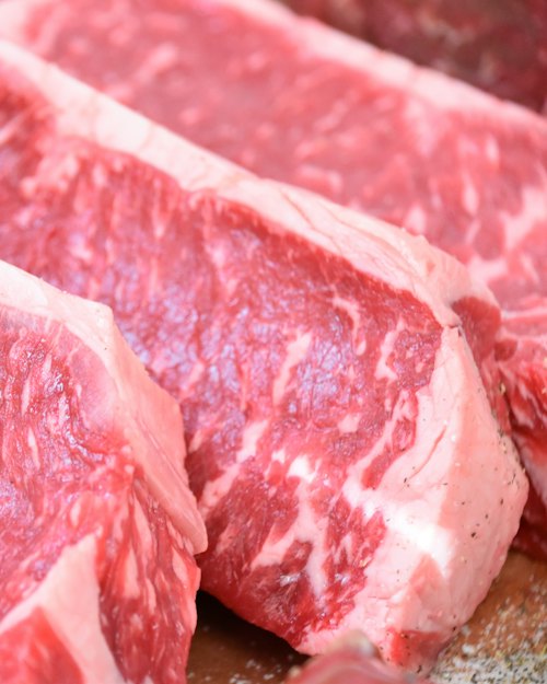 Marbled raw beef steaks